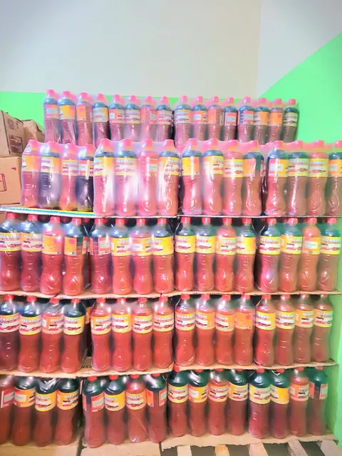 Stacked packs of Hizabrun oil in storage